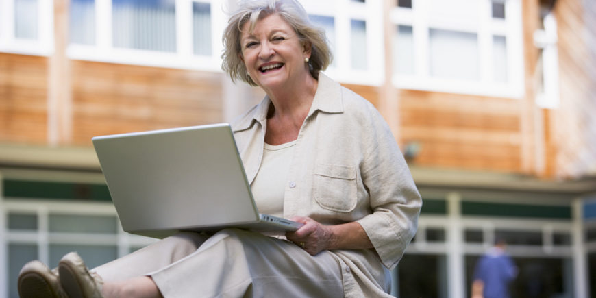 senior-woman-using-laptop-on-campus-10